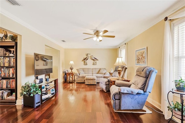 9621 Charlotte Dr, River Ridge, LA 70123 - living area with plenty of natural light, dark wood finished floors, a ceiling fan, and ornamental molding