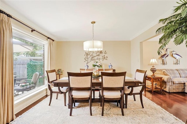 9621 Charlotte Dr, River Ridge, LA 70123 - dining room featuring wood finished floors, a chandelier, and crown molding