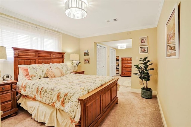 9621 Charlotte Dr, River Ridge, LA 70123 - bedroom with light colored carpet, ornamental molding, a chandelier, and a closet