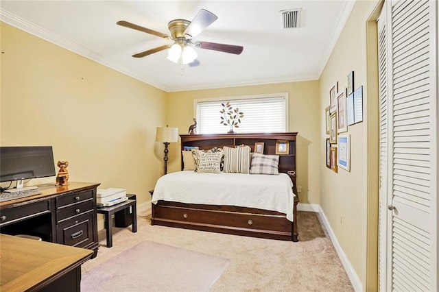9621 Charlotte Dr, River Ridge, LA 70123 - bedroom featuring light carpet, ornamental molding, an office area, a closet, and a ceiling fan