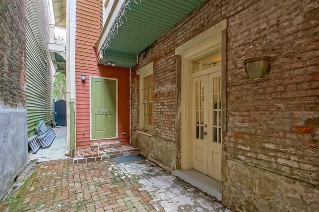 property entrance with brick siding
