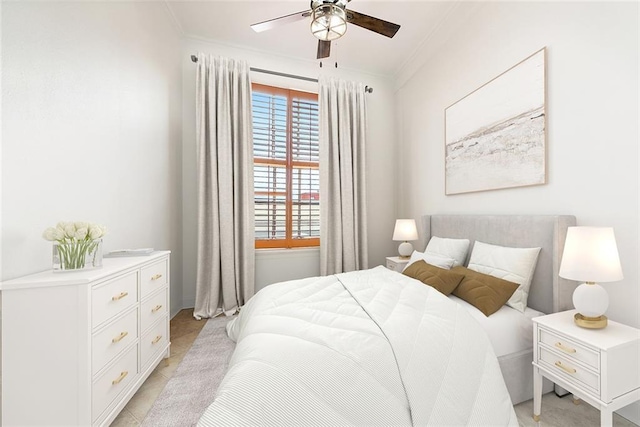 bedroom featuring ceiling fan, crown molding, and light tile patterned floors