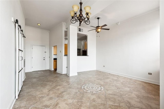 interior space featuring a barn door, visible vents, crown molding, baseboards, and ceiling fan with notable chandelier