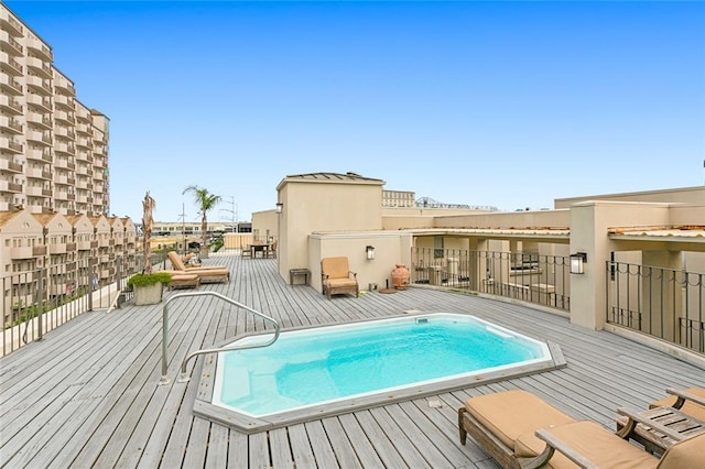 view of pool with a wooden deck