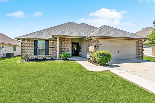 39521 Rue Royale, Prairieville, LA 70769 - view of front facade featuring concrete driveway, an attached garage, brick siding, and roof with shingles