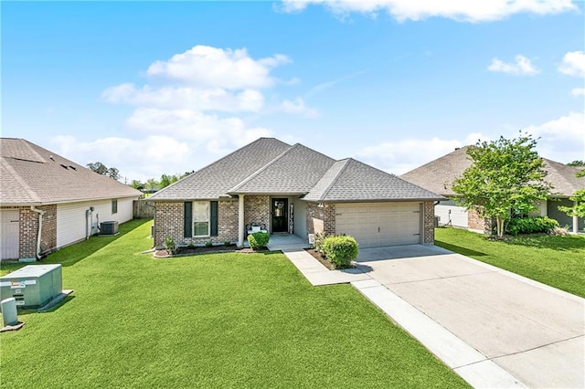 39521 Rue Royale, Prairieville, LA 70769 - view of front of home with a front lawn, brick siding, and a garage