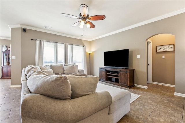 39521 Rue Royale, Prairieville, LA 70769 - tiled living room featuring a ceiling fan, arched walkways, baseboards, ornamental molding, and visible vents