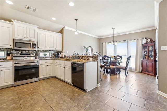 39521 Rue Royale, Prairieville, LA 70769 - kitchen with backsplash, visible vents, ornamental molding, and stainless steel appliances