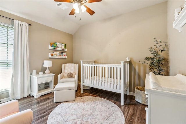 39521 Rue Royale, Prairieville, LA 70769 - bedroom featuring wood finished floors, visible vents, vaulted ceiling, a nursery area, and ceiling fan
