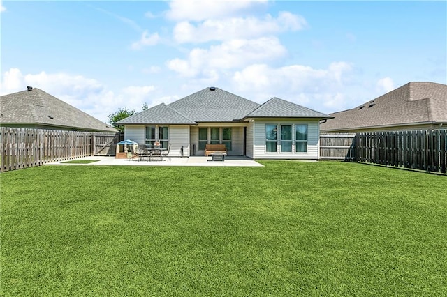 39521 Rue Royale, Prairieville, LA 70769 - back of house featuring a patio area, a lawn, a fenced backyard, and roof with shingles