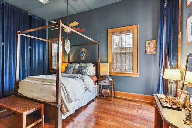 925 Touro St, New Orleans, LA 70116 - bedroom featuring baseboards and wood finished floors