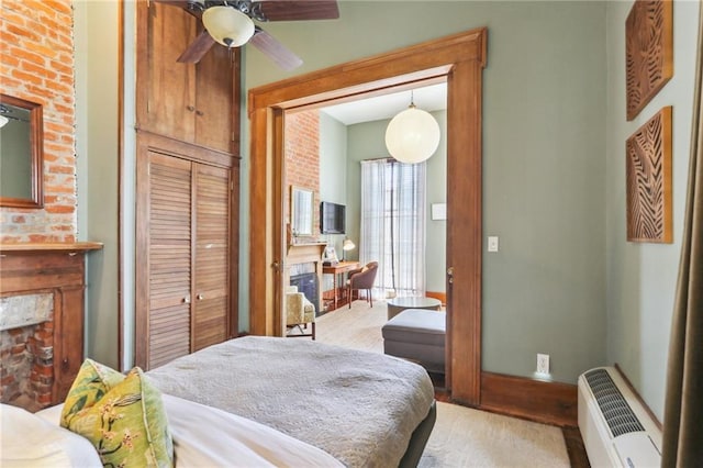 925 Touro St, New Orleans, LA 70116 - bedroom featuring light wood-type flooring, baseboards, and a closet