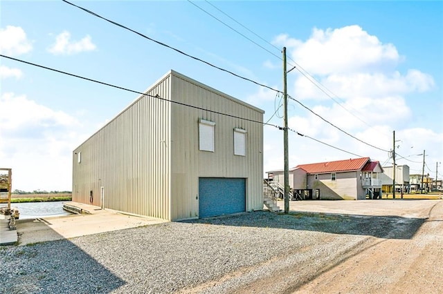 view of outbuilding featuring gravel driveway