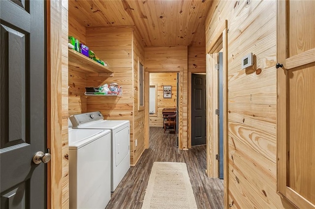 washroom featuring wooden walls, wooden ceiling, independent washer and dryer, and dark wood-type flooring