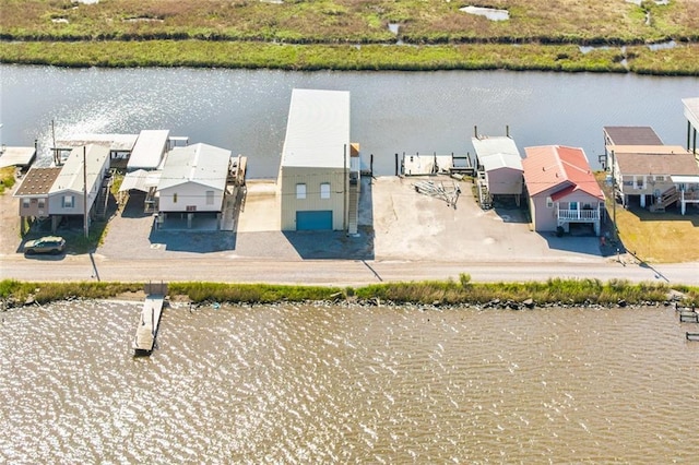 dock area featuring a residential view and a water view