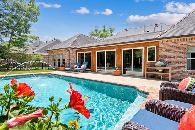 view of pool featuring fence, a fenced in pool, and a patio
