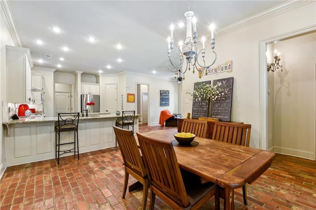 dining space with a notable chandelier, ornamental molding, brick floor, and recessed lighting