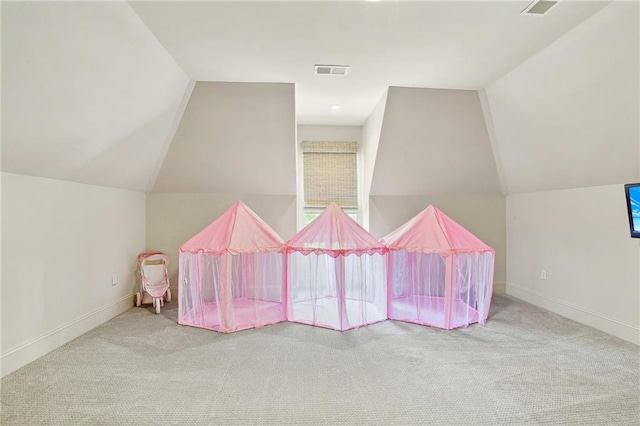 playroom with lofted ceiling, baseboards, visible vents, and carpet floors