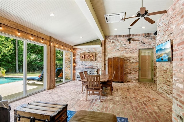 sunroom / solarium featuring beamed ceiling