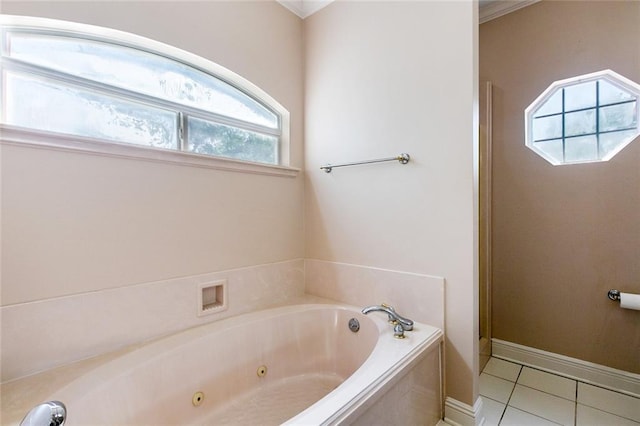 bathroom featuring baseboards, a jetted tub, and tile patterned flooring