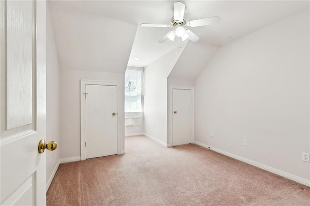 bonus room with vaulted ceiling, baseboards, carpet floors, and ceiling fan