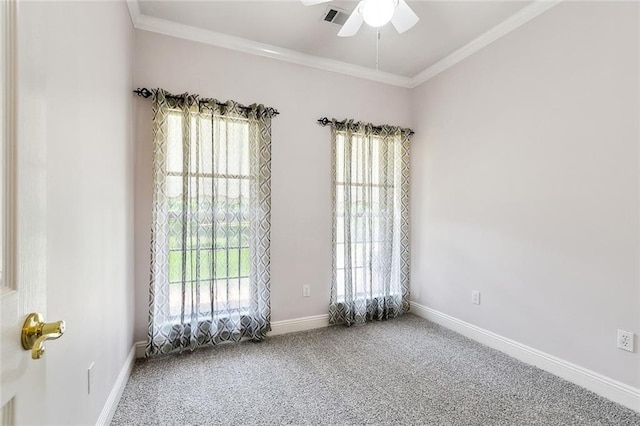carpeted empty room with a wealth of natural light, ceiling fan, and crown molding