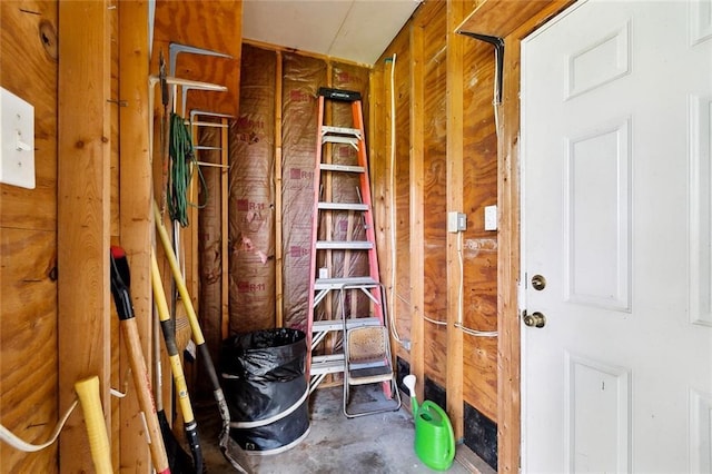 interior space featuring unfinished concrete flooring