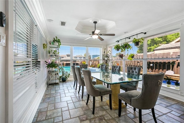 sunroom / solarium featuring plenty of natural light, outdoor dining area, and ceiling fan