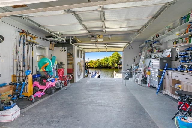 garage with a water view and a garage door opener