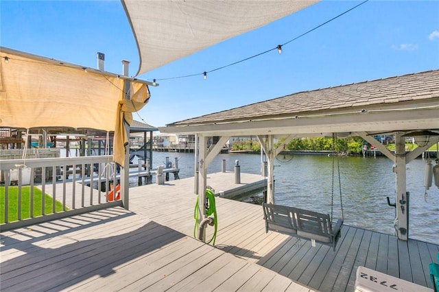 view of dock with a water view and boat lift
