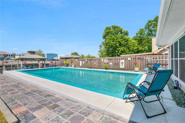 view of pool with a gazebo, fence, a patio area, and a fenced in pool