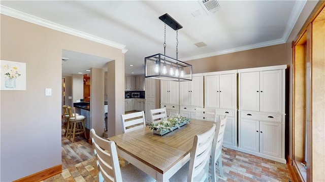 31765 River Pines Dr, Springfield, LA 70462 - dining area with baseboards, visible vents, and crown molding