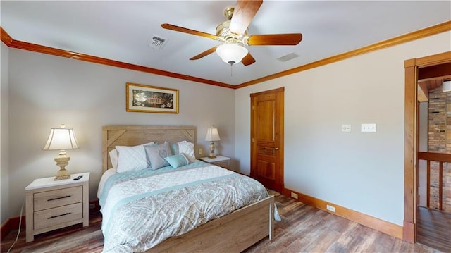 31765 River Pines Dr, Springfield, LA 70462 - bedroom featuring baseboards, wood finished floors, visible vents, and ornamental molding