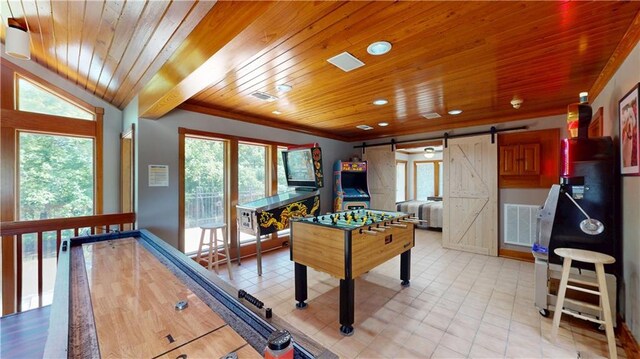 31765 River Pines Dr, Springfield, LA 70462 - rec room with wood ceiling, a barn door, a wealth of natural light, and visible vents
