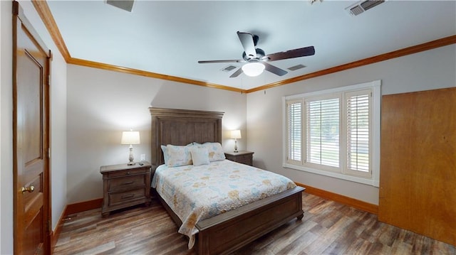 31765 River Pines Dr, Springfield, LA 70462 - bedroom featuring wood finished floors, visible vents, and baseboards