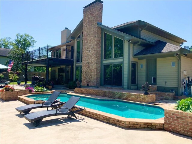 31765 River Pines Dr, Springfield, LA 70462 - outdoor pool featuring fence, a patio area, and a hot tub