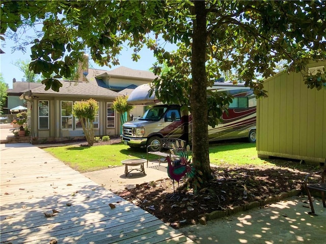31765 River Pines Dr, Springfield, LA 70462 - exterior space featuring a yard and a shingled roof