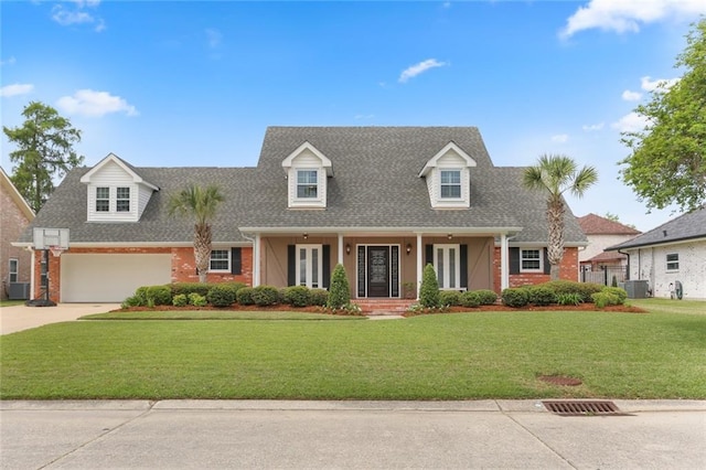 cape cod house with a porch, brick siding, roof with shingles, and concrete driveway