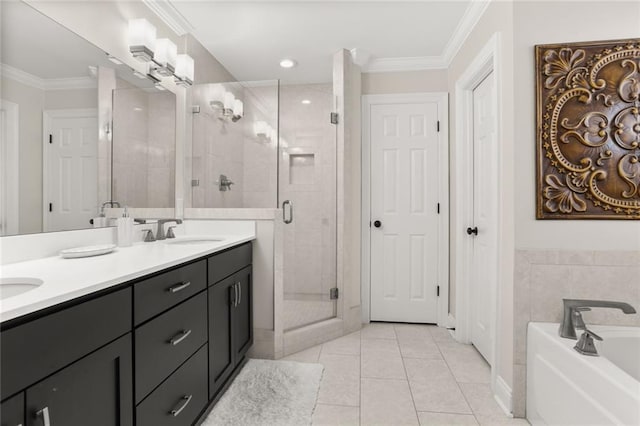 full bathroom with a bath, a sink, tile patterned flooring, a shower stall, and ornamental molding