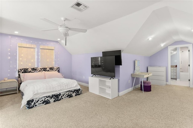 carpeted bedroom featuring vaulted ceiling, visible vents, ensuite bath, baseboards, and ceiling fan