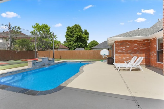 view of swimming pool with a fenced backyard, a patio area, and a fenced in pool