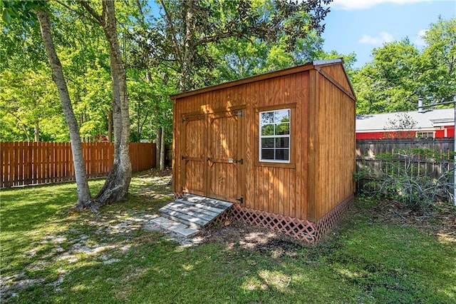 view of shed with a fenced backyard