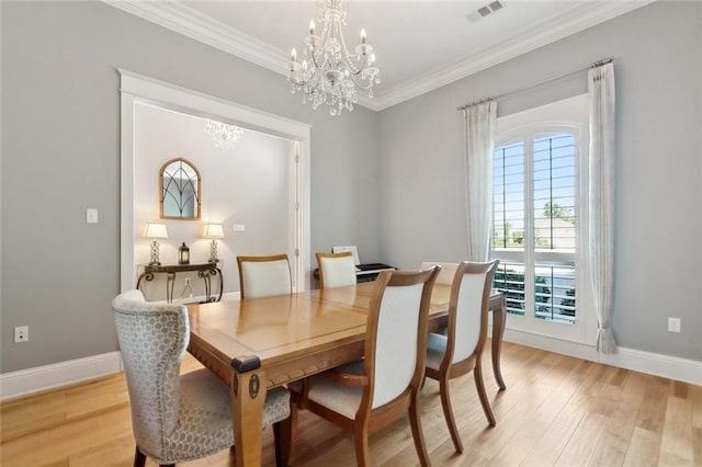 dining space with a notable chandelier, light wood-style floors, visible vents, and a healthy amount of sunlight