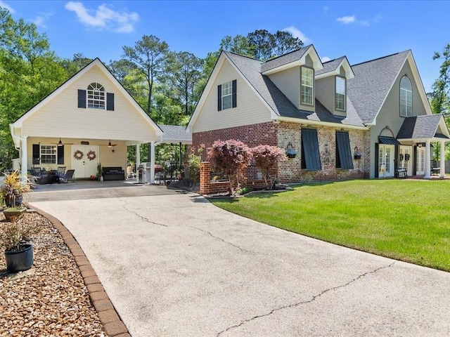 31035 Horseshoe Island Rd, Lacombe, LA 70445 - view of front of property featuring aphalt driveway, a front lawn, brick siding, and roof with shingles