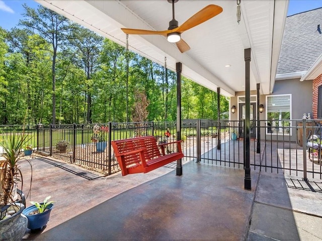 31035 Horseshoe Island Rd, Lacombe, LA 70445 - view of patio featuring fence, ceiling fan, and french doors
