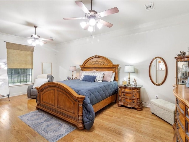 31035 Horseshoe Island Rd, Lacombe, LA 70445 - bedroom with light wood-style flooring, visible vents, a ceiling fan, and crown molding