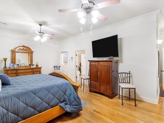 31035 Horseshoe Island Rd, Lacombe, LA 70445 - bedroom with a ceiling fan, light wood-style floors, and ornamental molding