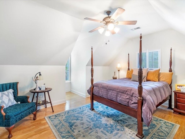 31035 Horseshoe Island Rd, Lacombe, LA 70445 - bedroom with lofted ceiling, visible vents, light wood finished floors, and multiple windows