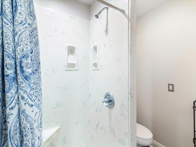 31035 Horseshoe Island Rd, Lacombe, LA 70445 - full bathroom with curtained shower, toilet, and baseboards