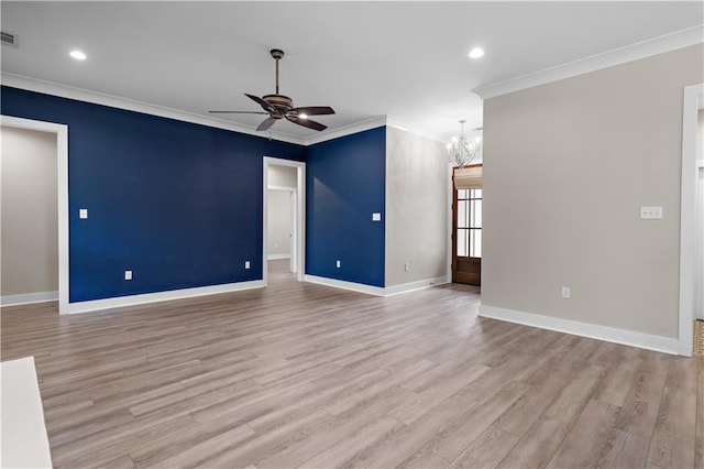 72421 Homestead St, Covington, LA 70435 - unfurnished living room with light wood finished floors, baseboards, recessed lighting, ceiling fan with notable chandelier, and ornamental molding